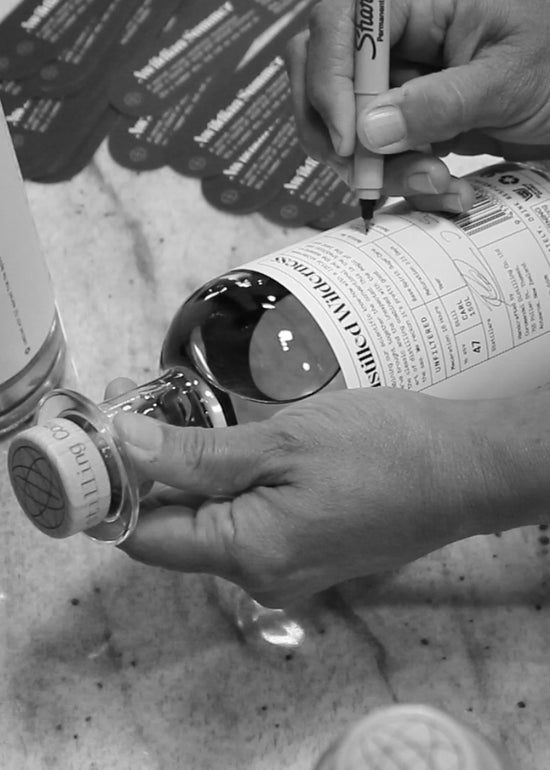 Awildian Gin is bottled and labelled by hand in our Thames gin distillery